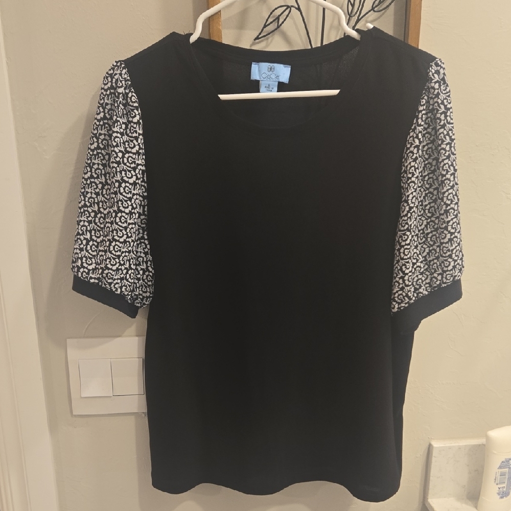 CeCe Black Top with White Patterned Sleeves